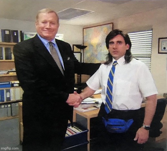 Two men shaking hands in an office
